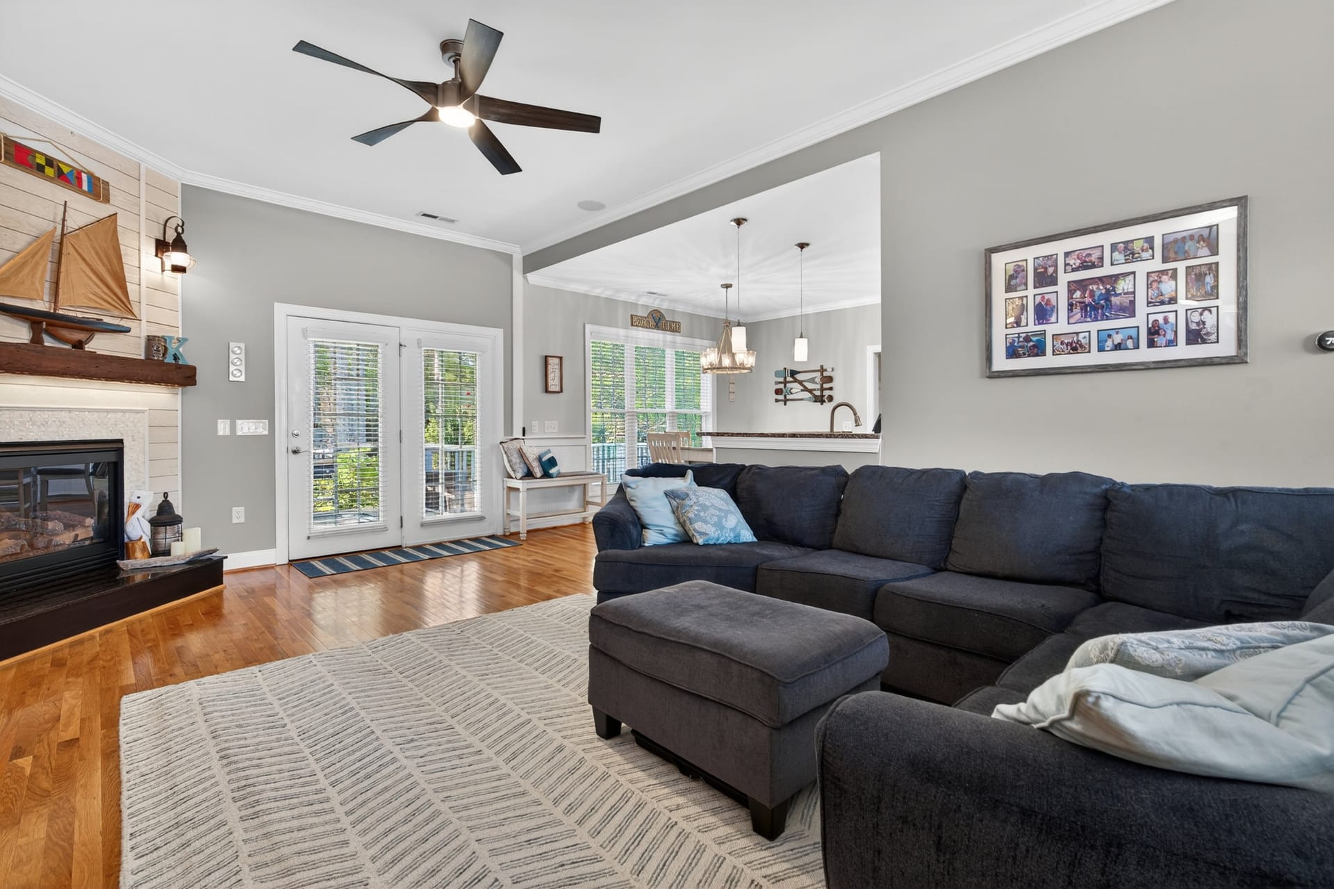Living room with fireplace view to kitchen