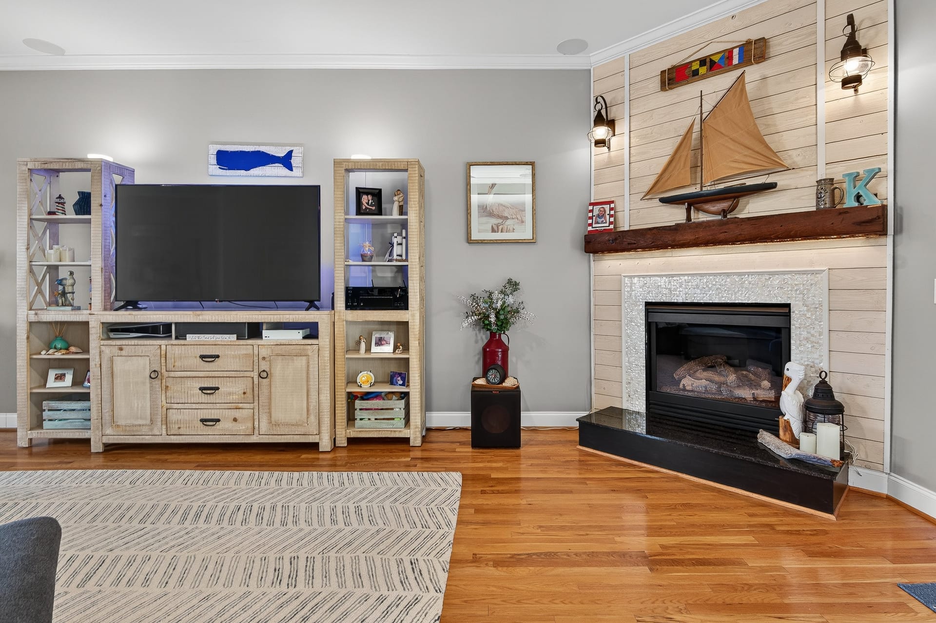 Living room with fireplace and shiplap wall