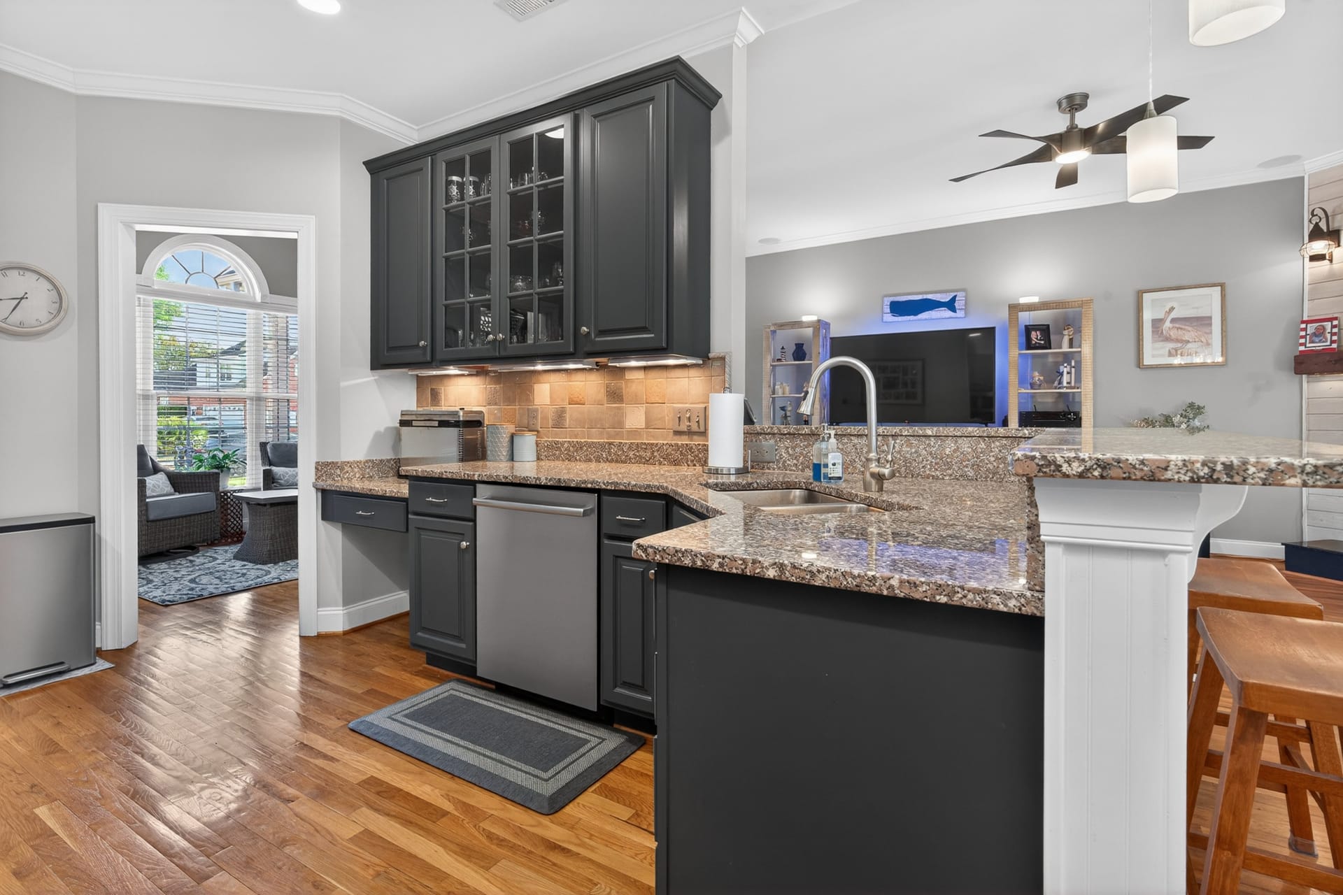 Kitchen island with breakfast bar and glass cabinets