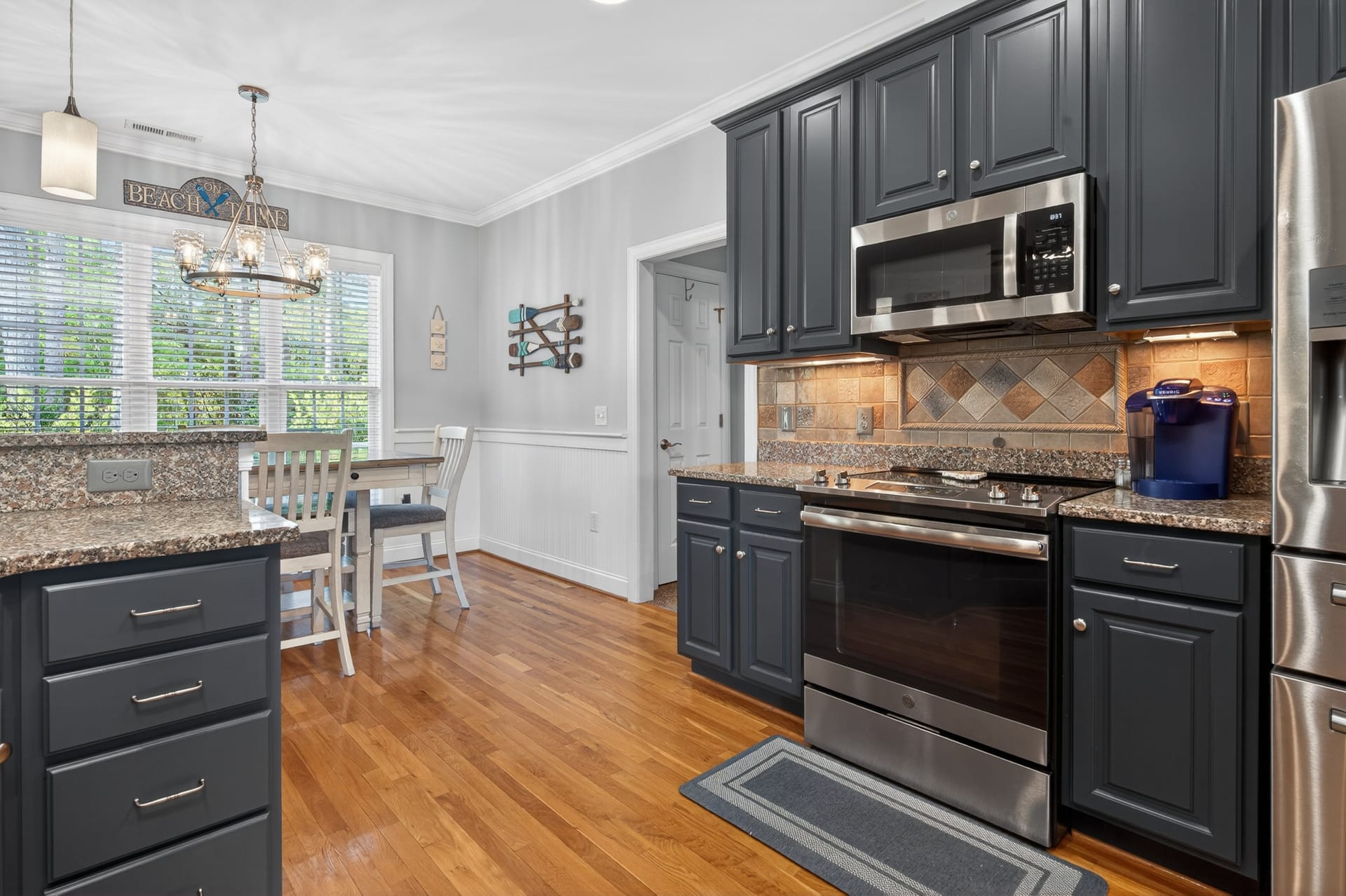 Kitchen with stove and stainless appliances