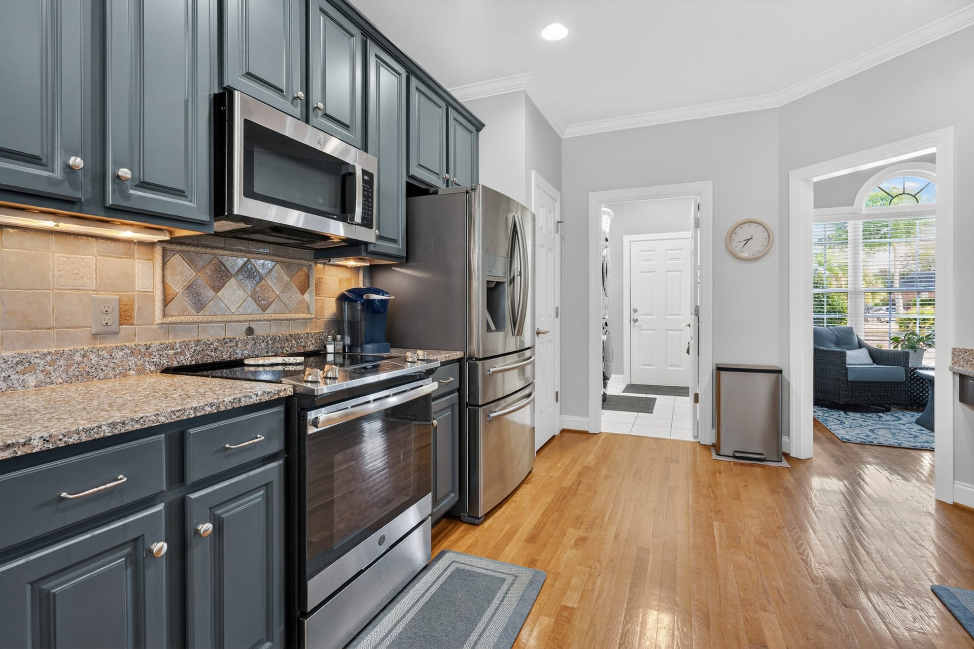 Kitchen view toward laundry and foyer