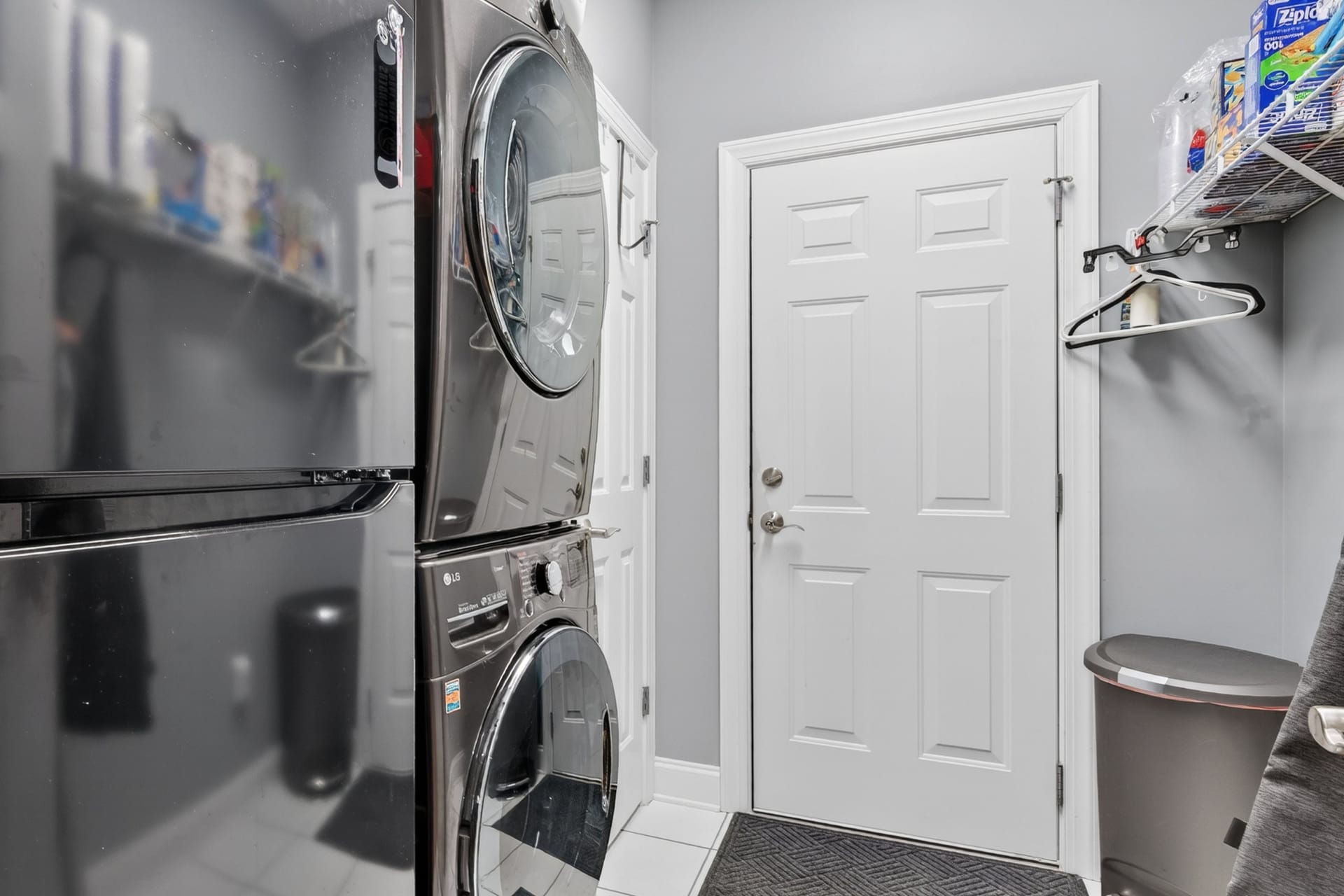 Laundry room with stacked washer dryer