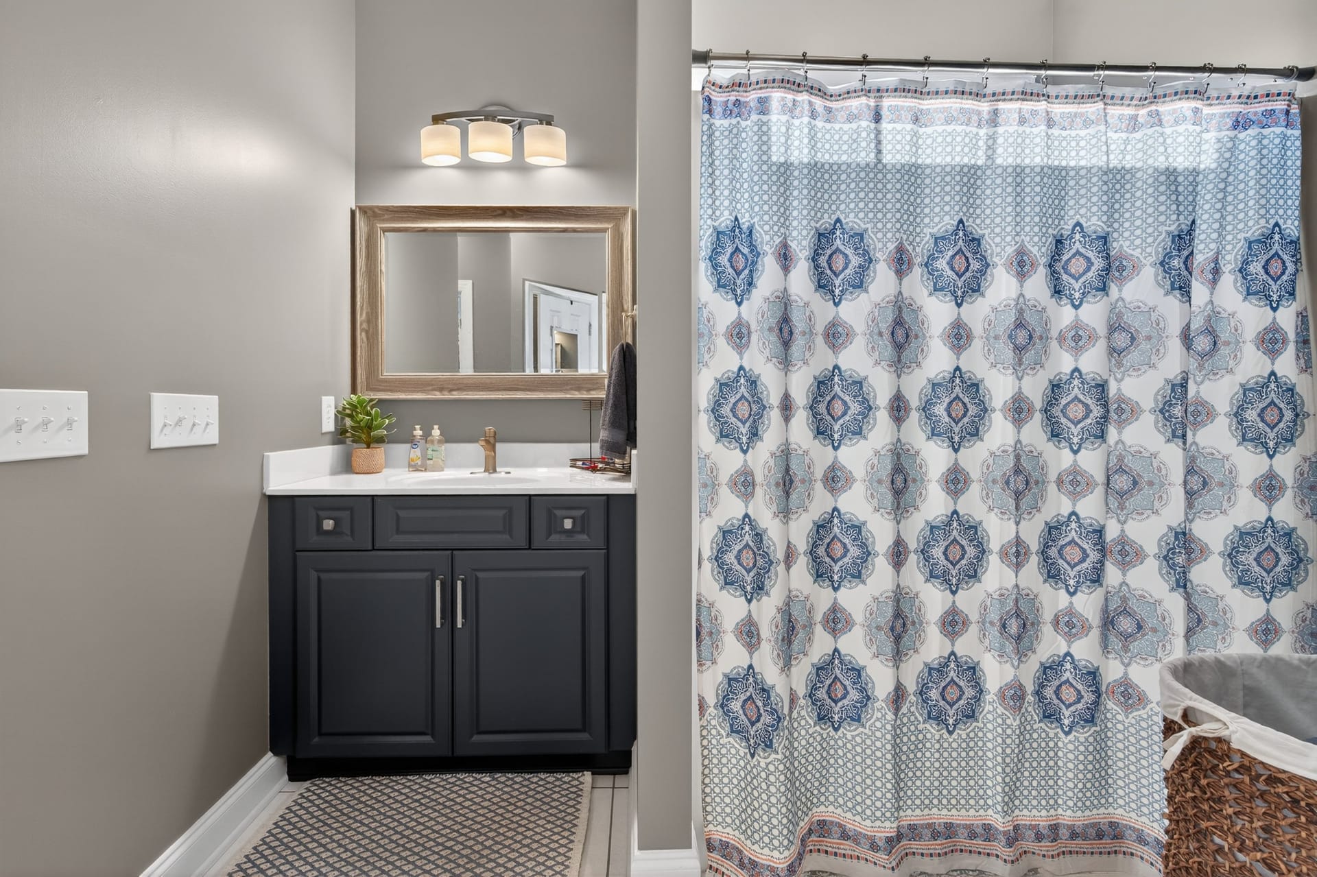 Guest bathroom with navy vanity