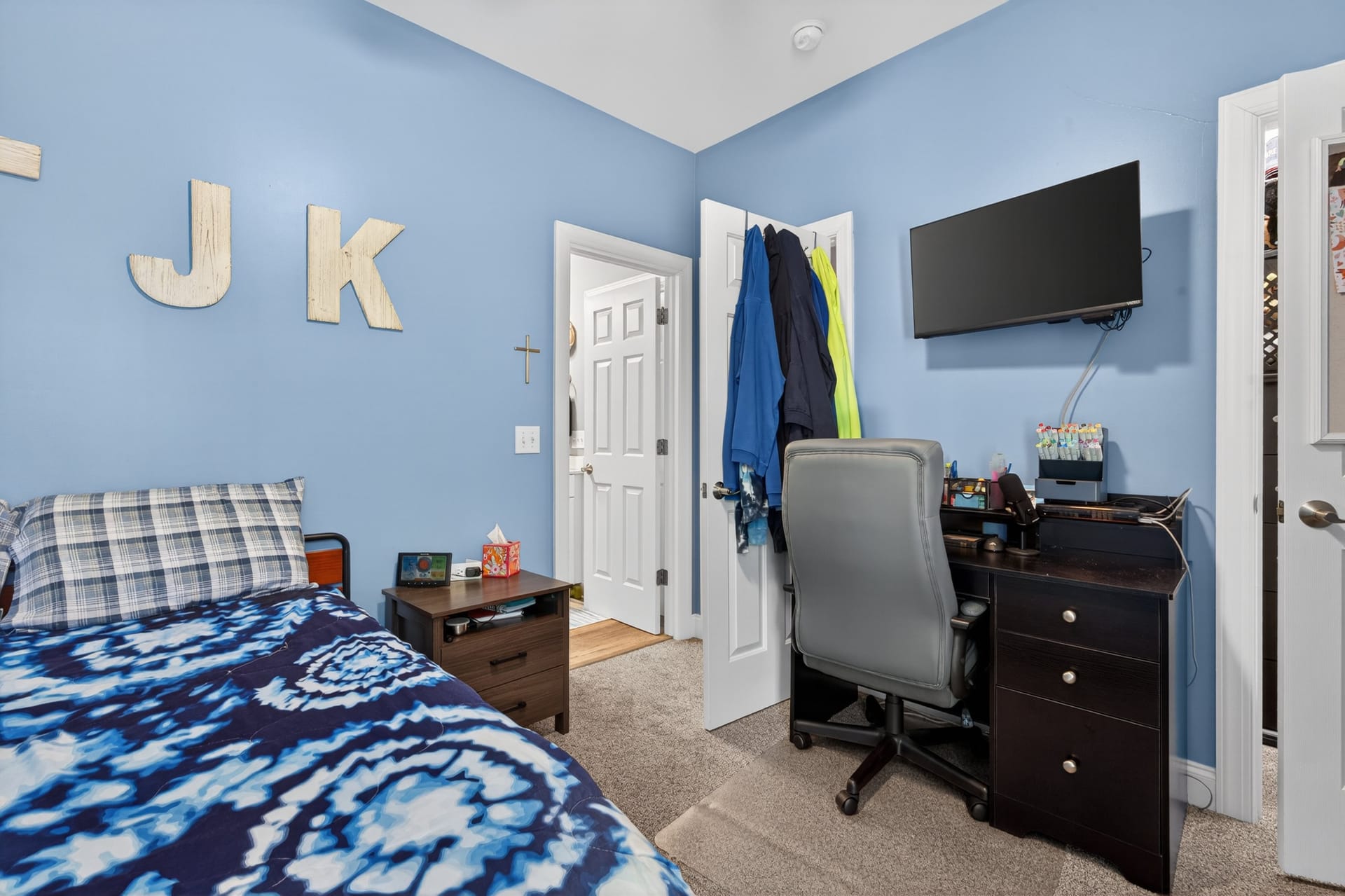 Blue bedroom with desk area