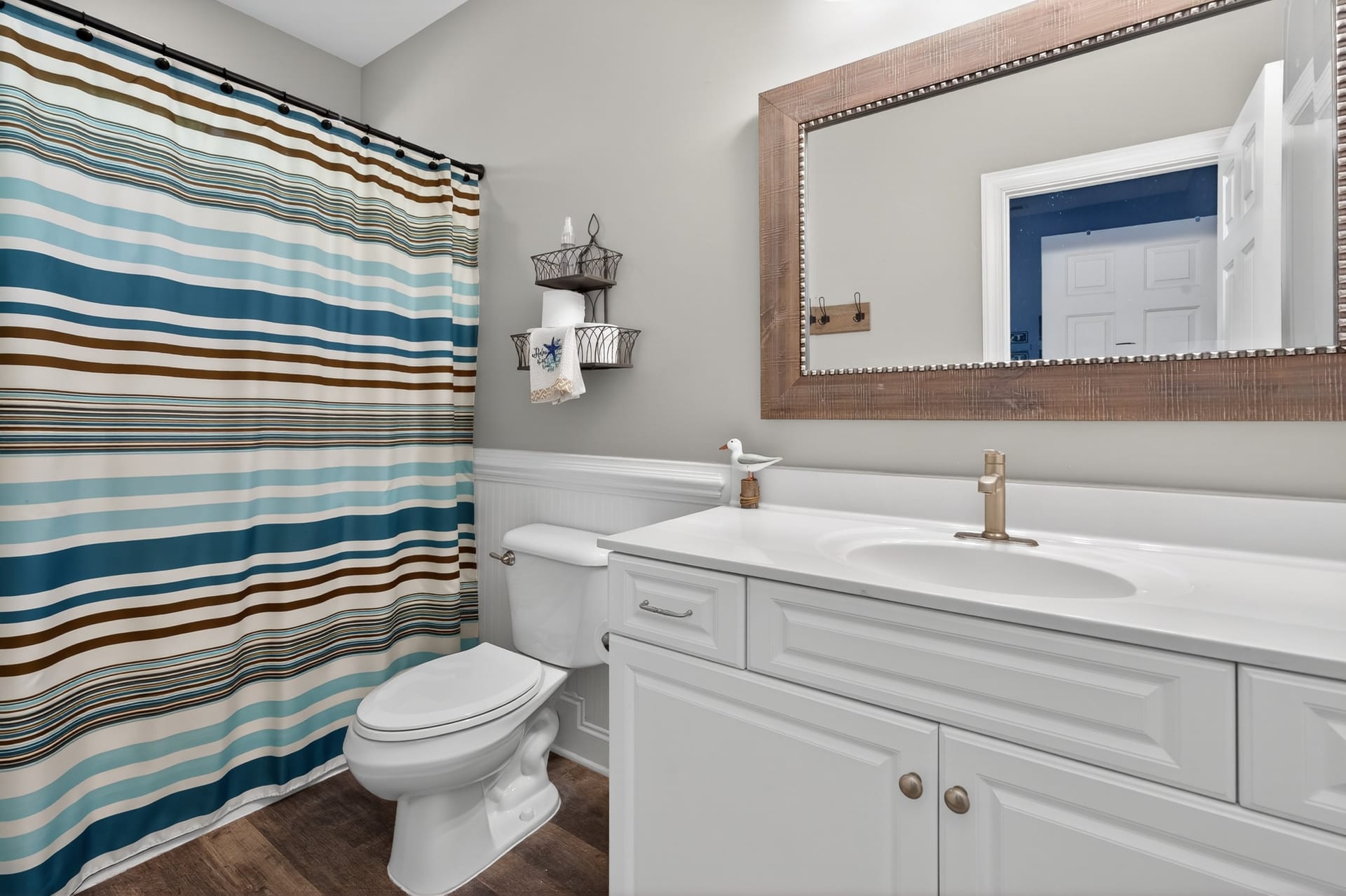 Guest bathroom with striped shower curtain