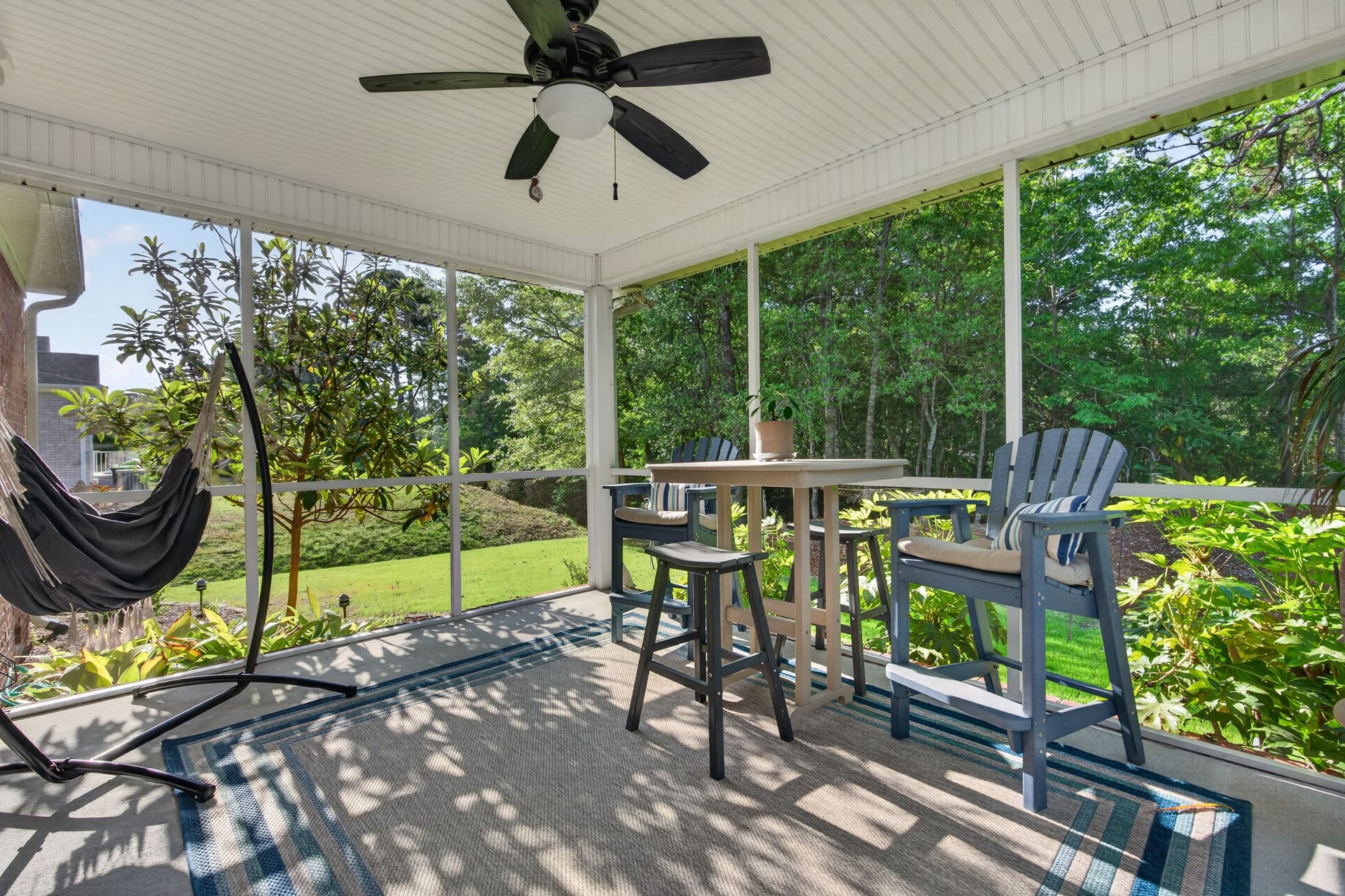 Screened porch with hammock and seating