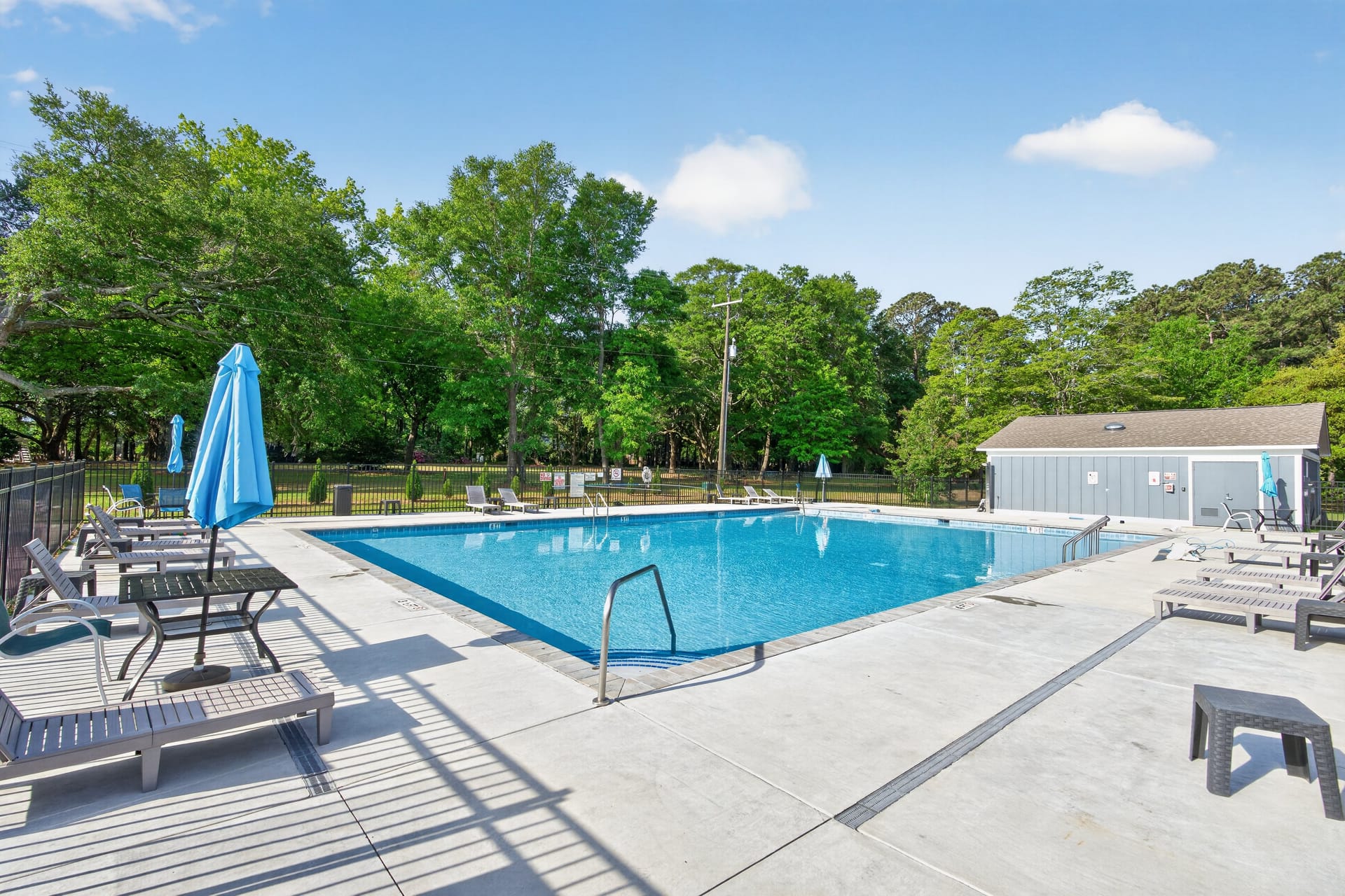 Community pool with lounge chairs